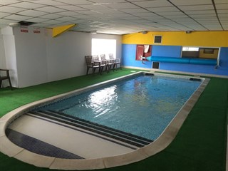 swimming facilities at Millers Cottage Caravan Park, Towyn
