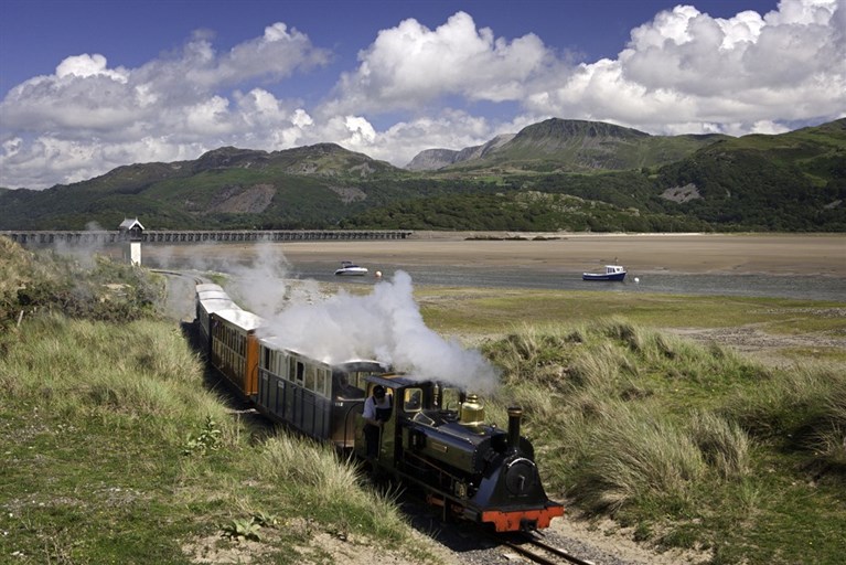 Train with Barmouth Bridge in background