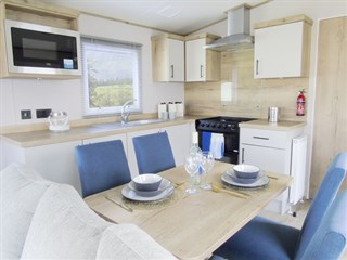 ABI Hamilton Static Caravan Holiday Home dining area to kitchen