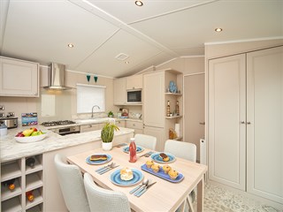 2025 Carnaby Lakehouse Static Lodge Holiday Home dining room to kitchen