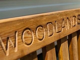 engraved bench at woodlands caravan park, pwllheli