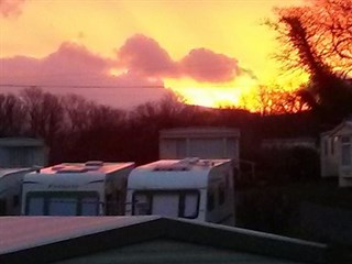 Sun set over Plas Gwyn Caravan Park