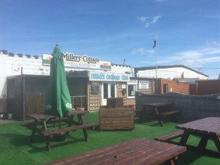 children's play area at Millers Cottage Caravan Park, Towyn