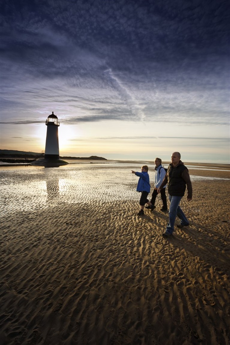 Walking at sunset nearTalacre lighthouse